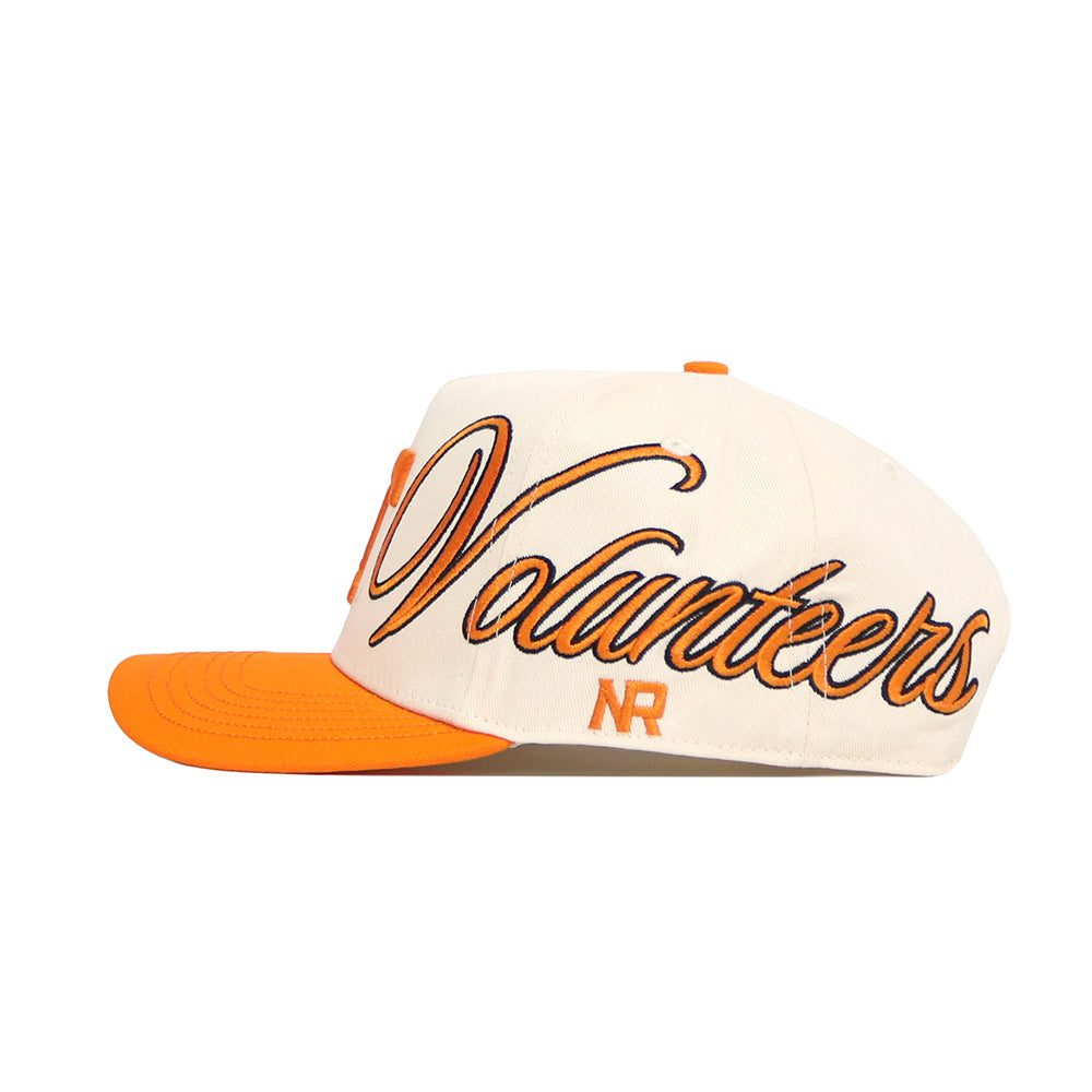 The No Rivals Tennessee Halftime Hat is a white and orange snapback with a structured fit, "Volunteers" in large script on the side, “NR” below, and an orange bill and button.