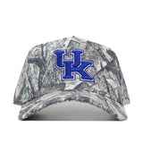 The No Rivals Kentucky Outland Hat is a camouflage baseball cap with a structured fit, showcasing a bold blue UK logo outlined in white on the front center.