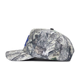 The No Rivals Kentucky Outland Hat is a high-quality cotton snapback with a camouflage pattern, flat brim, blue embroidered letter on the front, and white NR letters on the side panel for a structured fit.