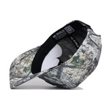 The Kentucky Outland Hat by No Rivals is a camouflage snapback, shown upside down to reveal its black inner band, white crown support, and No Rivals branding. Made from high-quality cotton, it’s displayed against a plain white background.