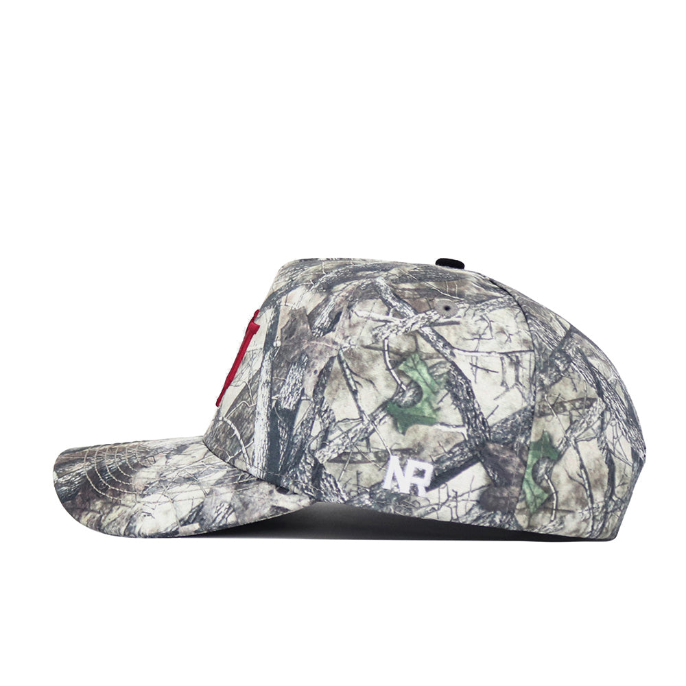 A side view of the No Rivals Indiana Outland Hat, featuring a camouflage pattern, red letter front, and small white side logo. Made from high quality cotton, this snap-back cap rests on a white background.