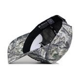 The South Carolina Outland Hat by No Rivals is shown at an angled side view, featuring a structured brim, inside lining with black piping, an adjustable snapback strap, and an interior “NO RIVALS” label.