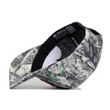 The Nebraska Outland Hat by No Rivals is displayed upside down on a white background, revealing its black inner band and the "NO RIVALS" print inside. This high-quality cotton cap features a bold camouflage pattern.