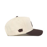 The No Rivals Washington State Espresso Hat is a cream snapback baseball cap with a brown brim and a small brown Washington State silhouette embroidered near the back—perfect for adding classic style to your gameday look.