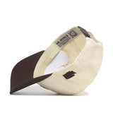 The No Rivals Washington State Espresso Hat is a beige and brown Snap Back baseball cap, shown inside out to reveal tags, stitching, and brim details. A small brown graphic near the brim adds the perfect touch to your Gameday Fit.