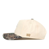 Side view of the Wichita State Camo Connector Hat by No Rivals—beige snapback with a camo brim and gold NR initials on the side, perfect for your gameday fit.