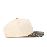 The No Rivals Wichita State Camo Connector Hat features a beige crown, camo bill, and embroidered logo—shown in side profile against a white backdrop, it’s the perfect choice for gameday style.