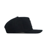 The Texas A&M Night Mode Hat by No Rivals features a black high crown, flat brim, and structured fit, shown from the side with no visible logos or designs on the visible side.