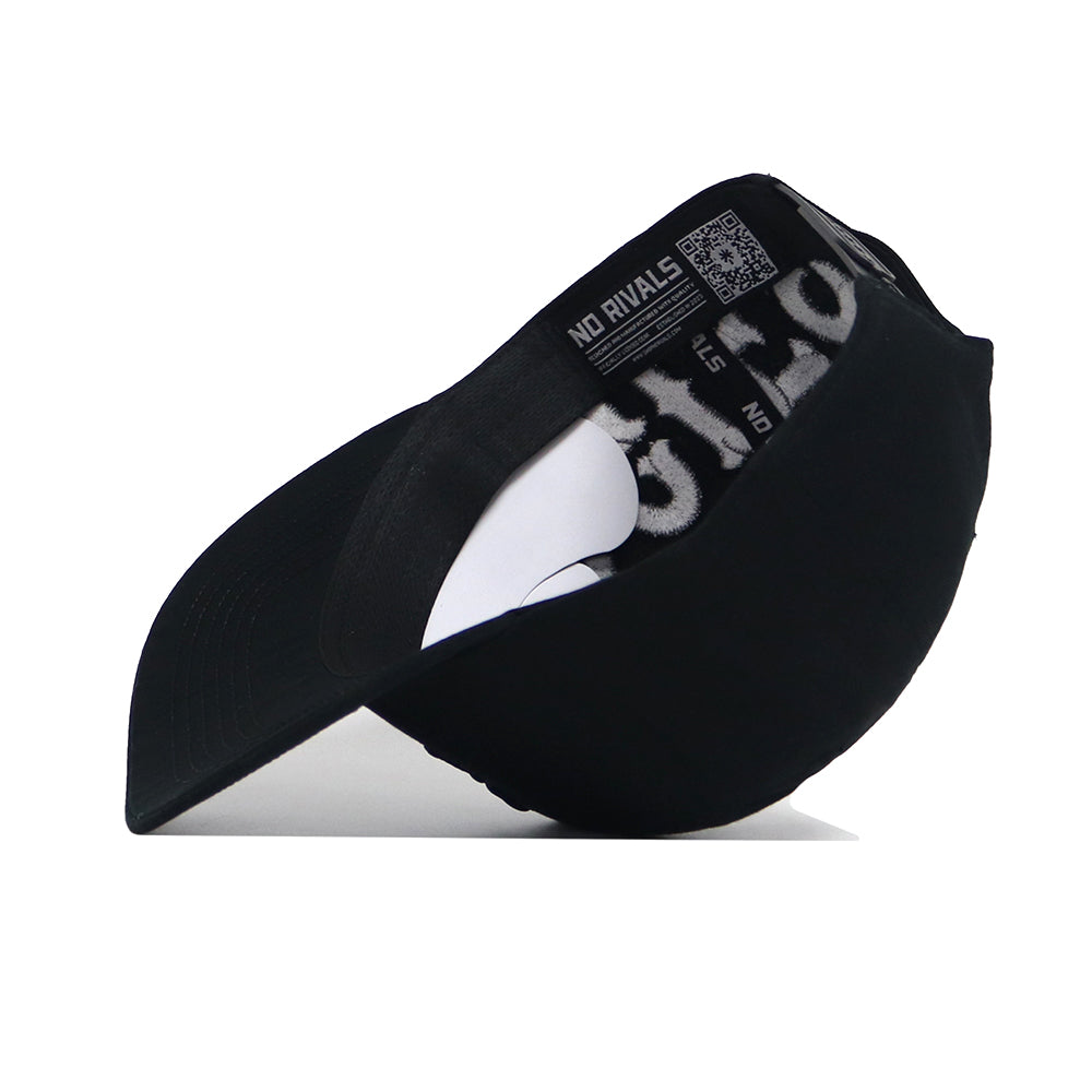 The Texas A&M Night Mode Hat by No Rivals is shown flipped inside out, displaying its inner labels and stitching. The brim faces left, with "NO RIVALS" visible on an interior strip of this black high crown cap.