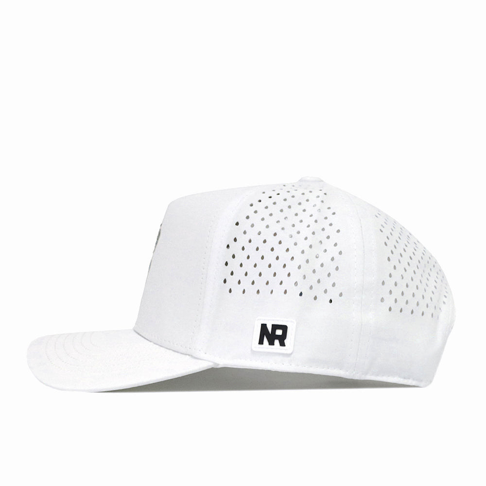 A No Rivals North Carolina Tar Heels Mascot Hat in white, featuring performance fabric with small perforated holes on the back panels and an NR embroidered logo patch on the side. This Snap Back Hat is shown from the left side against a plain white background.