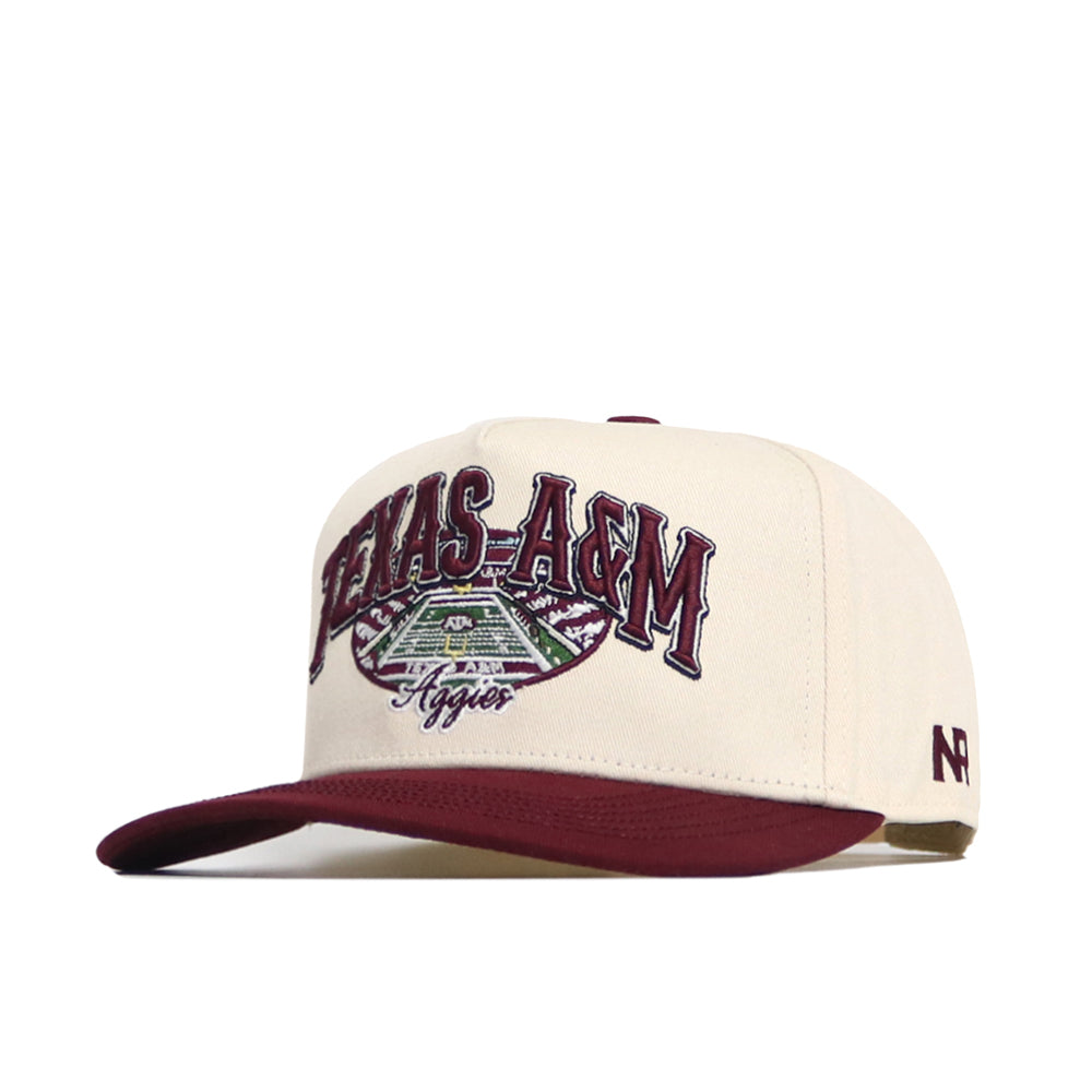 The No Rivals Texas A&M Stadium Hat is a cream and maroon snapback featuring "Texas A&M Aggies" above a stadium graphic, a maroon brim, structured fit, high quality cotton, and a small NR logo on the side.