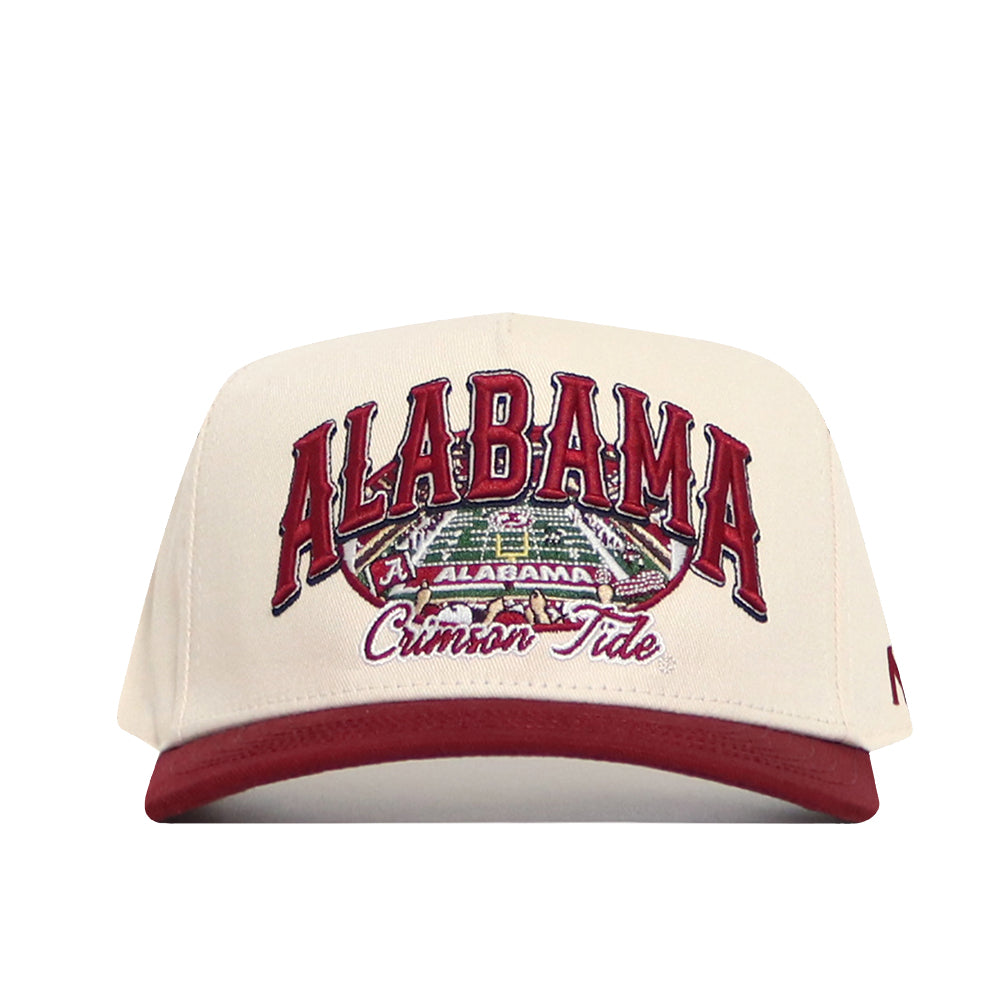 The No Rivals Alabama Stadium Hat is a beige structured snapback with a red brim, embroidered "Alabama Crimson Tide" and a football field image. Made from high-quality cotton, it combines comfort and team pride.