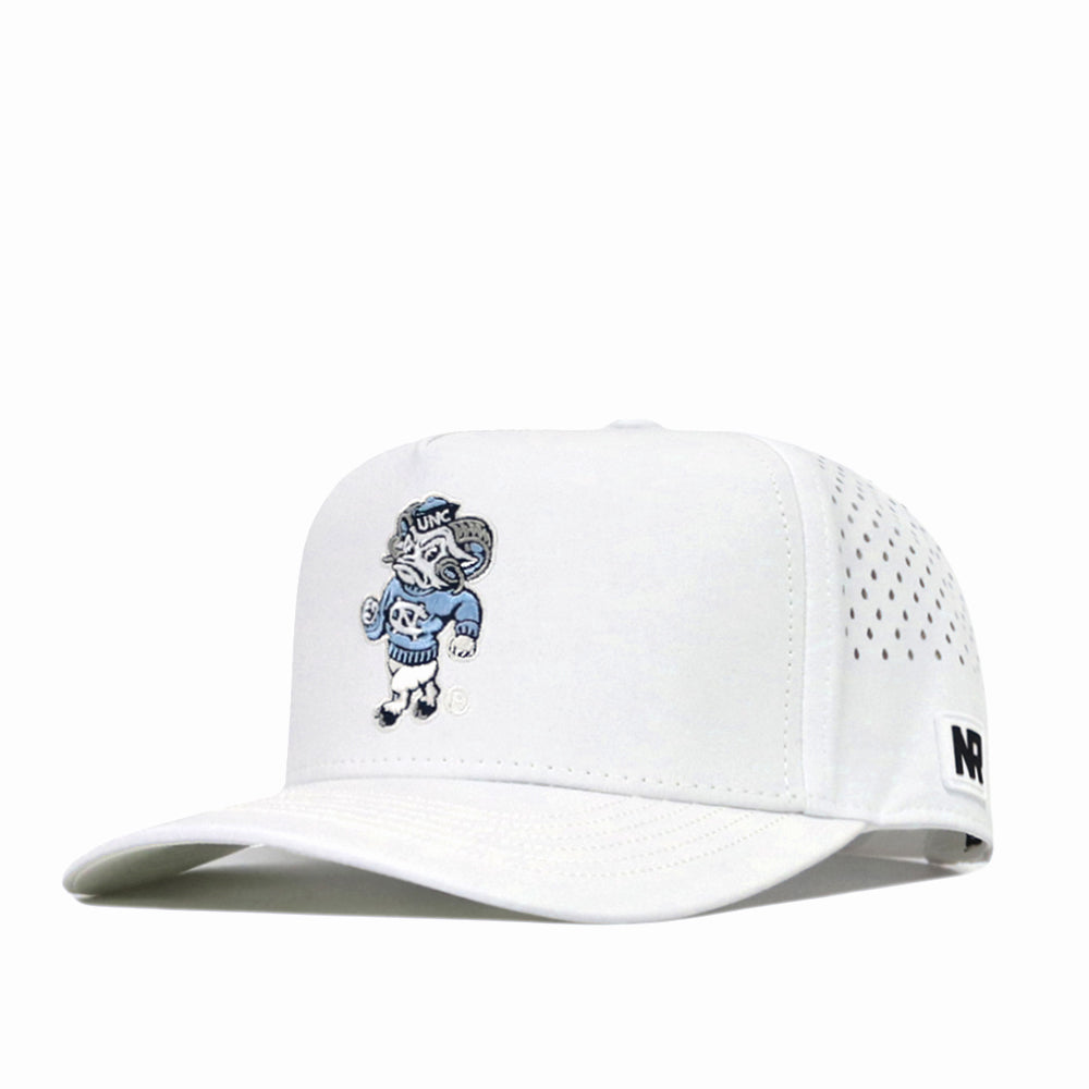 The North Carolina Tar Heels Mascot Hat by No Rivals is a white performance fabric hat featuring an embroidered cartoon ram mascot on the front. It includes small ventilation holes on the sides and a black-and-white NR label on the side of the brim.