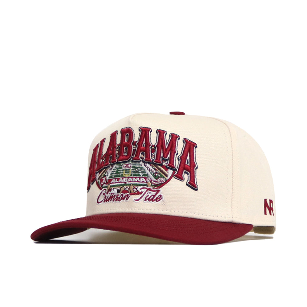 The Alabama Stadium Hat by No Rivals is a cream and maroon snapback with ALABAMA Crimson Tide and a football field graphic on the front, maroon brim, structured fit, quality cotton, and a maroon NR logo on the side.