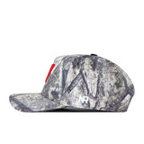 The Wisconsin Badgers Outland Hat by No Rivals features a camouflage pattern with a bold red embroidered “N” on the front and a small white NR logo on the side. It comes with a classic snap back adjustment for the perfect gameday fit and is shown in profile view against a white background.