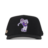 Introducing the JMU Dukes Golf Hat - Black by No Rivals, a stylish black baseball cap adorned with an embroidered mascot swinging a golf club and sporting a JMU shirt. It features a small JMU patch on the left side of the brim and is designed with a Snap Back Adjustment for an ideal Gameday Fit. Show off your school spirit in style with this expertly embroidered logo cap.