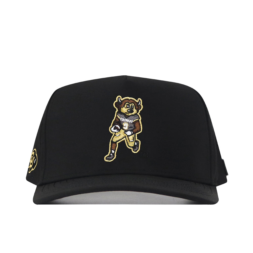 Introducing the Colorado Football Hat - Black by No Rivals. This black hat showcases an embroidered cartoon buffalo mascot holding a football on the front, outfitted in a gold and white uniform. A small gold embroidered logo accents the left side, while a classic snap back closure completes the look—making it the perfect gameday accessory for any fan.