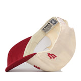 The Right Side Up Indiana Hat - Classic Colors by No Rivals is pictured inside out, displaying a label, a QR code, and a stitched red letter M on the cream section. This officially licensed cap also includes an embroidered logo for added authenticity.