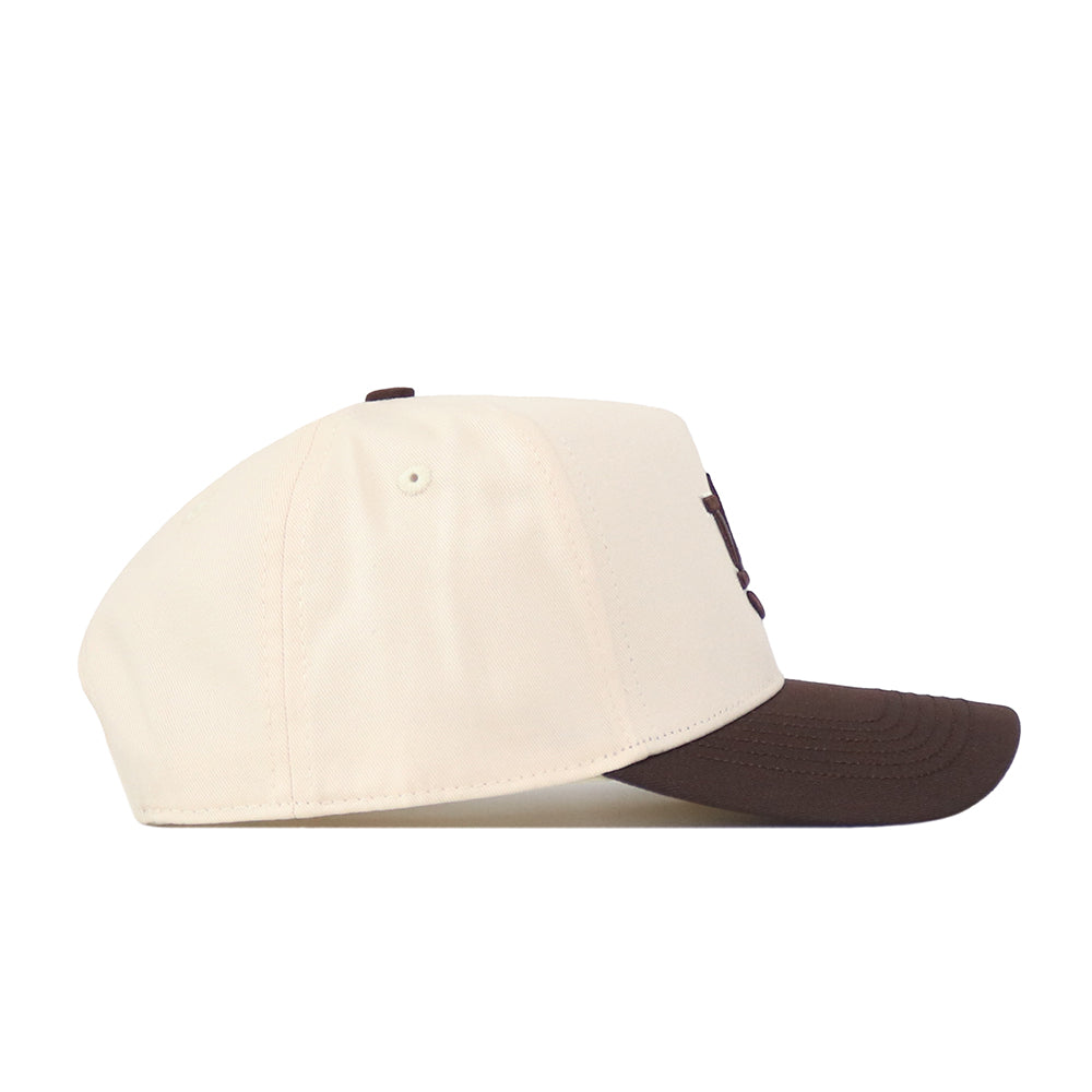 Side view of the No Rivals Auburn Espresso Hat, featuring a cream-colored crown and a dark brown brim with an embroidered logo on the front. The classic snapback design offers an adjustable fit, showcased against a plain white background.