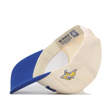 A cream and blue snapback baseball cap from No Rivals, called the Right Side Up Jacks Hat - Classic - South Dakota State Jackrabbits, is pictured upside down to reveal a yellow jackrabbit logo on the side and a NO RIVALS label inside the adjustable band.
