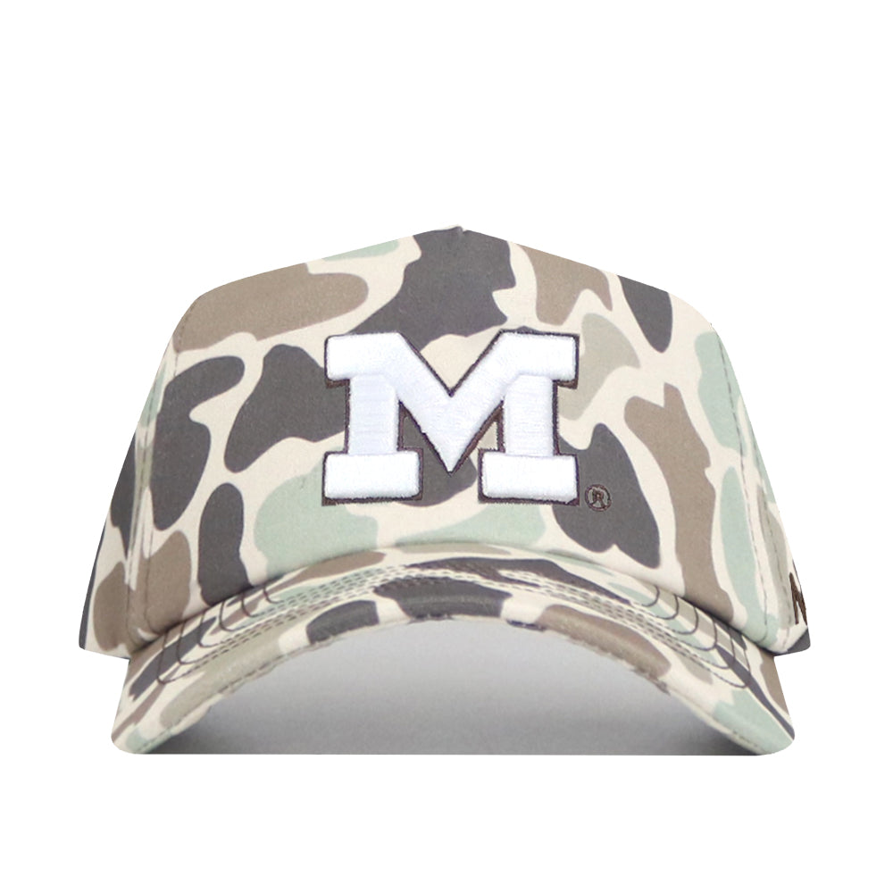The No Rivals Michigan Wolverines Huntsman Hat is a camouflage snapback baseball cap featuring a bold white embroidered “M” outlined in black on the front. With its mix of green, brown, and tan shades, this hat is the perfect finishing touch for your gameday outfit.