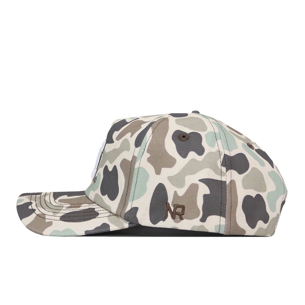 Showcased in a side profile, the Michigan Wolverines Huntsman Hat by No Rivals features a classic camouflage pattern in shades of green, brown, and beige. The cap is finished with NR lettering embroidered in brown on the side, adding a stylish accent that’s perfect for your gameday look.