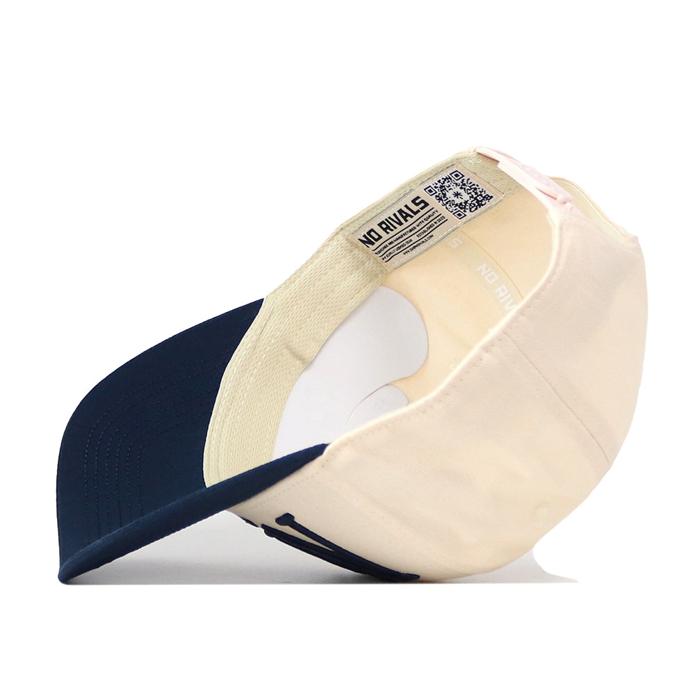 The No Rivals Nevada Wolf Pack Stride Hat is pictured upside down, showcasing its interior tags, stitching, sweatband, and premium cotton construction.