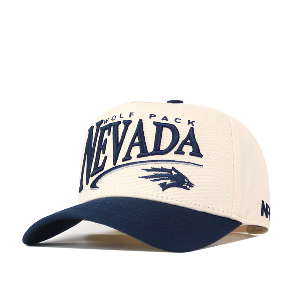 Crafted from high-quality cotton, the No Rivals Nevada Wolf Pack Stride Hat is a cream and navy snapback baseball cap featuring “Nevada Wolf Pack” and a detailed embroidered wolf logo on the front. The hat has a navy brim, with “NR” stitched on the side, and all embroidered accents provide a premium finish.