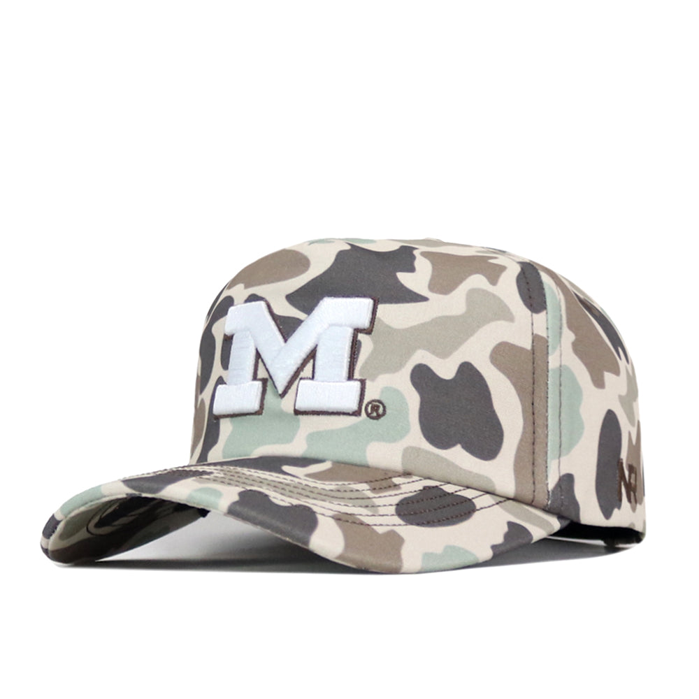 The Michigan Wolverines Huntsman Hat by No Rivals features a camouflage snapback design with a prominent white embroidered “M” logo on the front—perfect for completing your gameday look.