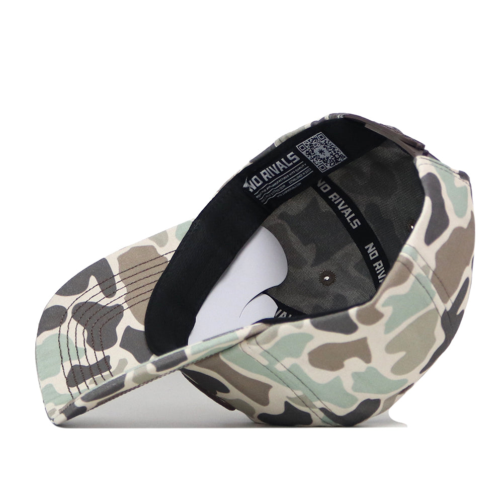 The Georgia Bulldogs Huntsman Hat by No Rivals is pictured upside down to showcase its inner lining and black sweatband, which features the NO RIVALS brand name printed in white. Made from high-quality cotton, this structured fit cap offers both comfort and durability, with a classic camouflage pattern and snapback design.