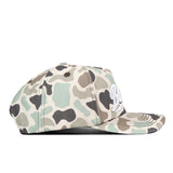 A side view of the No Rivals Sam Houston State Huntsman Hat reveals its camouflage pattern, flat brim, and front white embroidered logo. This high-quality cotton cap features a convenient snap back closure.