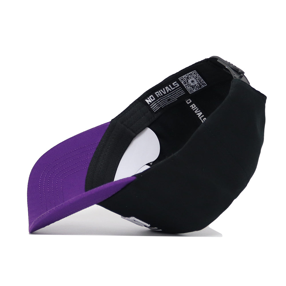 The No Rivals LSU Tailgate Hat is a black and purple snapback with a curved purple brim, adjustable back strap, and visible NO RIVALS text inside. Made from high-quality cotton, tags and stitching are also seen when viewed from the side.