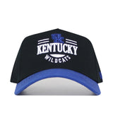 The No Rivals Kentucky Tailgate Hat is a black snapback with a blue brim, featuring an embroidered blue UK logo and "Kentucky Wildcats" on the front. Made from high-quality cotton for a structured fit.