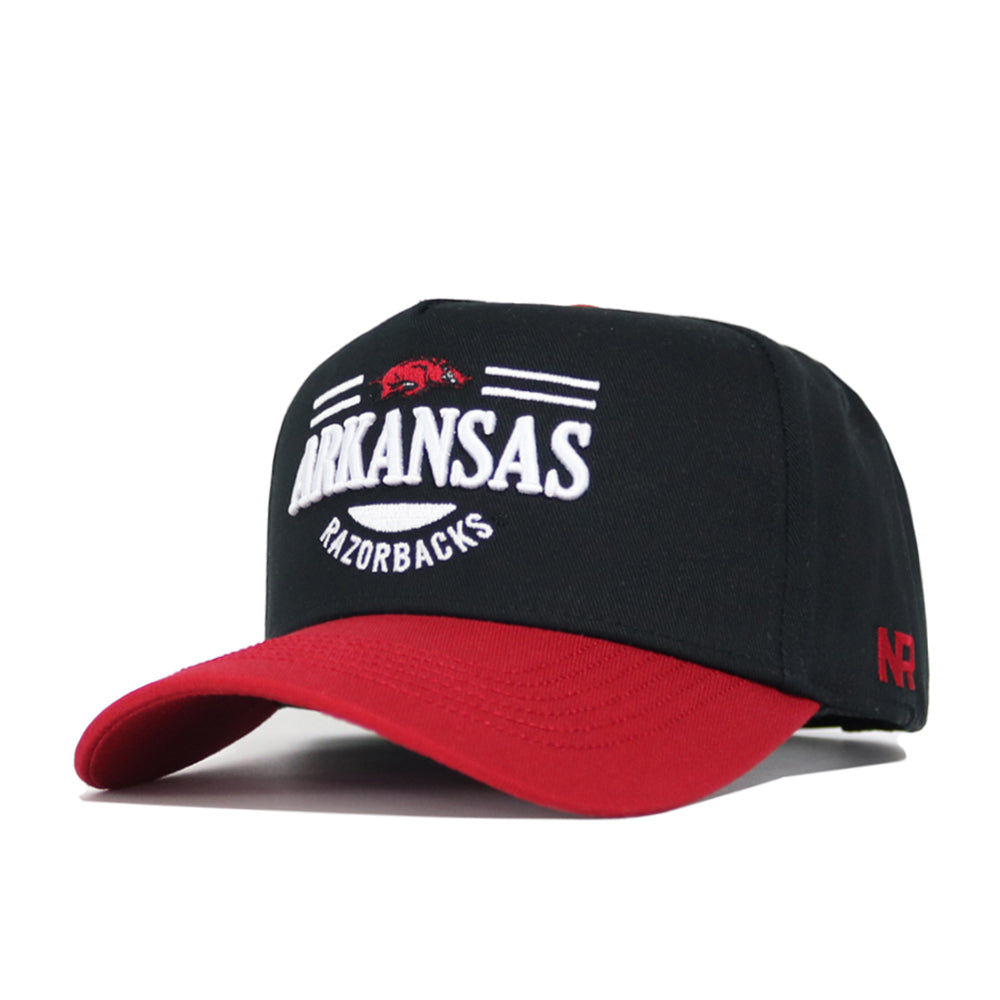 The No Rivals Arkansas Tailgate Hat is a black and red snapback featuring "ARKANSAS RAZORBACKS" and a red hog logo embroidered on the front. Made from quality cotton, it has a structured fit and a red bill with white and red accents.