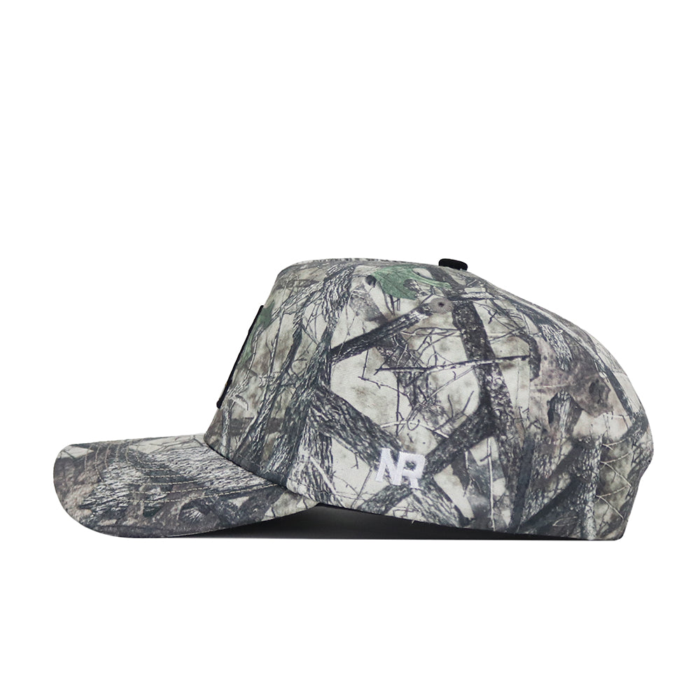 The No Rivals App State Outland Hat is a camouflage flat-brim baseball cap, made of high quality cotton and detailed with a subtle white NB logo on the side near the brim.