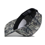 A Michigan State Outland Hat by No Rivals is shown lying on its side, revealing the black interior band and underside of the brim. Made from high-quality cotton, this structured cap features "NO RIVALS" printed inside.