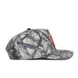 A side view of the No Rivals Clemson Outland Hat, a snapback with a flat brim. It features high quality camouflage cotton in gray, black, and green with a tree-branch print and a partially visible red front design.