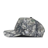 A side view of the No Rivals Florida State Outland Hat, a structured fit flat-brim cap in woodland camouflage with white NR initials embroidered on the side, crafted from high quality cotton.