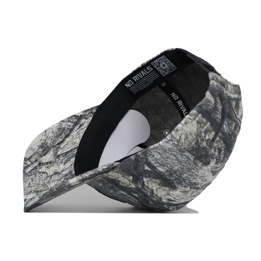 The Florida State Outland Hat by No Rivals is shown in a camouflage pattern from an angled side view. This structured cotton cap features a curved brim, shape-retaining white insert, and inside label reading NO RIVALS.