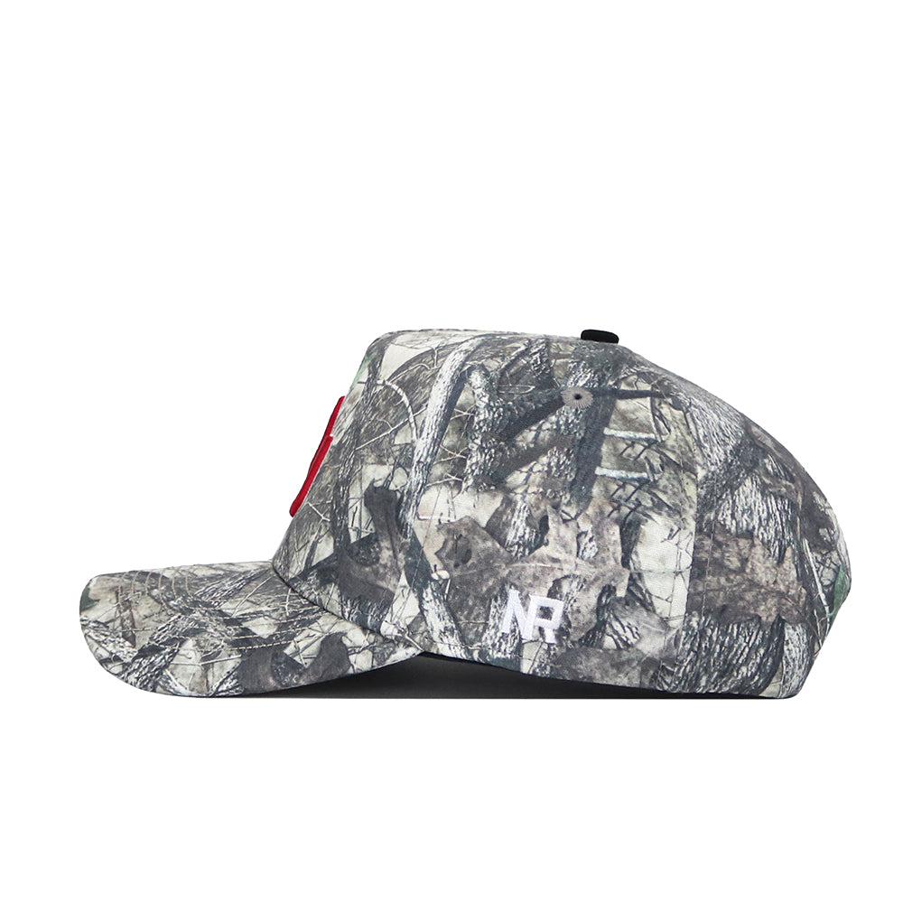 A side view of the No Rivals Oklahoma Outland Hat, a structured cotton camo baseball cap with a red front logo, white NF lettering on the side, curved brim, snapback closure, and top button.