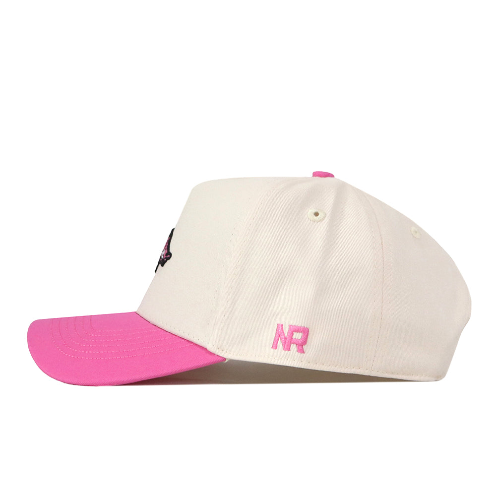 The Arkansas Pink Out Hat by No Rivals is a white snapback cap featuring a pink brim and pink NR embroidery on the side, displayed in a side profile view against a white background. This officially licensed hat is an ideal choice for supporting the Breast Cancer Foundation in style.