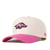Show your support in style with the officially licensed Arkansas Pink Out Hat from No Rivals. This white snapback features a pink brim, a pink razorback logo on the front, and pink embroidered text on the side.