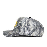 The Iowa Outland Hat by No Rivals is a camo baseball cap with a curved brim, yellow embroidered B on the front, and small white NR on the side. Made from high-quality cotton, this snapback is shown on a white background.