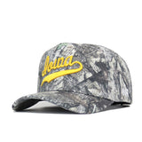 The No Rivals Iowa Outland Hat is a camouflage cotton baseball cap with "Iowa" embroidered in yellow script on the front and a snapback closure, shown against a white background.