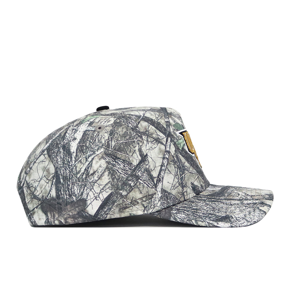 A side view of the No Rivals UCF Outland Hat, a snapback cap in gray and black camo with brown accents. Made from high-quality cotton, it features a flat brim, structured fit, and an embroidered front design.