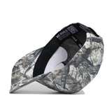 A UCF Outland Hat by No Rivals, shown on its side to display the camouflage pattern, inside lining, QR code label, and “NO RIVALS” printed on the inner band.