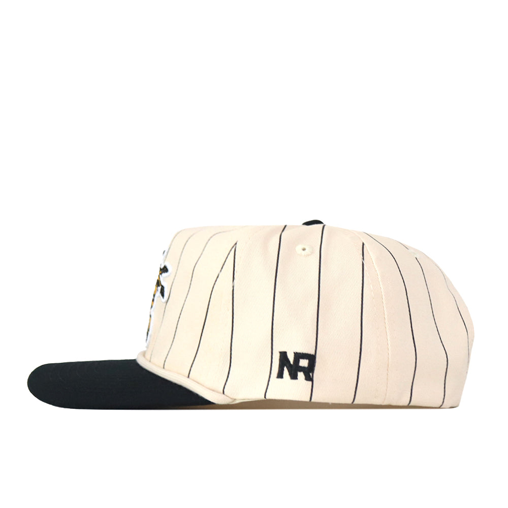 The Wichita State Pinstripe Hat by No Rivals features cream cotton with black pinstripes, a black brim, and NR embroidered on the side. Shown in side view, this is a stylish snap back cap.