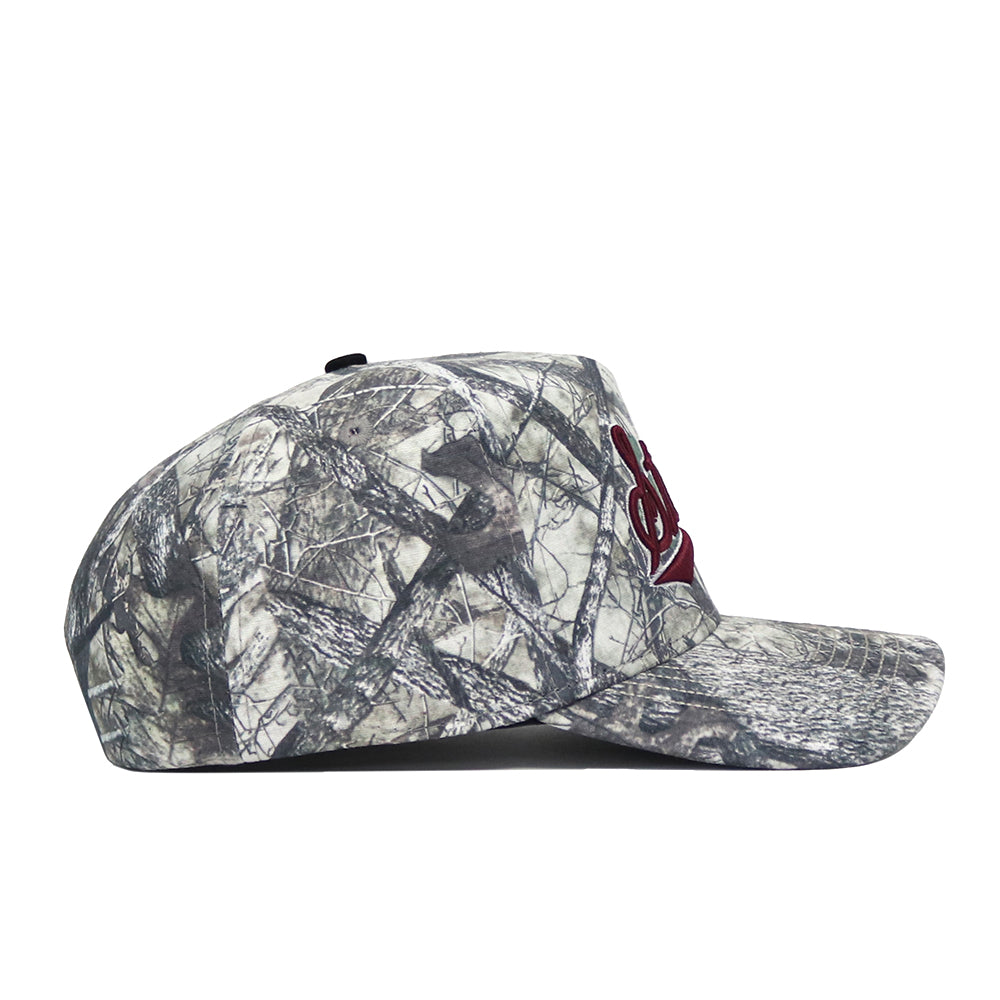 The No Rivals Mississippi State Outland Hat is a high-quality cotton camouflage snapback with a flat brim and red embroidered front logo, shown in left side profile against a white background.
