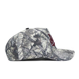 The No Rivals Mississippi State Outland Hat is a high-quality cotton camouflage snapback with a flat brim and red embroidered front logo, shown in left side profile against a white background.