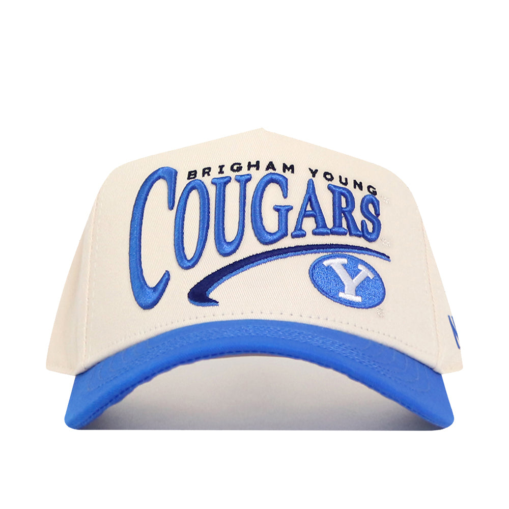Show off your team spirit with the BYU Cougars Stride Hat from No Rivals—a cream and blue snapback featuring Brigham Young Cougars lettering and an embroidered BYU logo on the front, perfect for finishing your gameday look.
